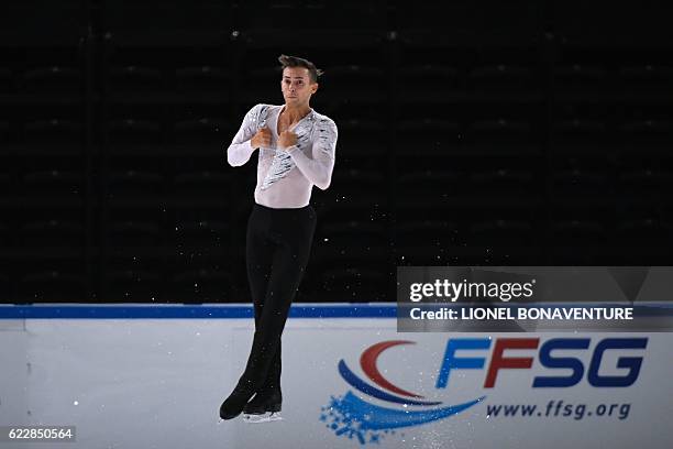 S Adam Rippon performs during the Men Free program at the ISU Grand Prix of Figure Skating in Paris on November 12, 2016. / AFP / LIONEL BONAVENTURE