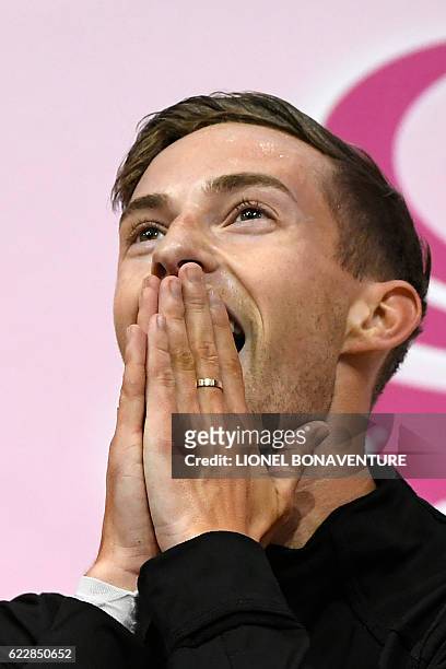 S Adam Rippon reacts while listenting to the results after performing in the Men Free program at the ISU Grand Prix of Figure Skating in Paris on...