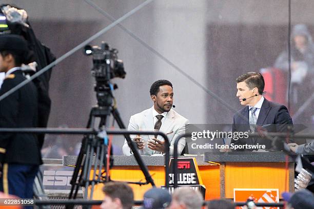 College GameDay TV hosts Desmond Howard and Rece Davis chat on set during live filming of ESPN College GameDay before the game between Washington and...