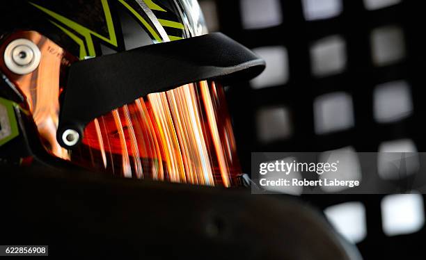 Kurt Busch, driver of the Monster Energy/Haas Automation Chevrolet, sits in his car during practice for the NASCAR Sprint Cup Series Can-Am 500 at...