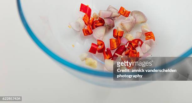 chopped red pepper, challot and garlic. - cayenne powder stock pictures, royalty-free photos & images