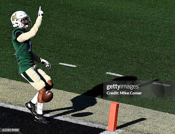 Defensive back Terrance Winchester of the Charlotte 49ers celebrates after running back an interception for a touchdown against the Rice Owls at...