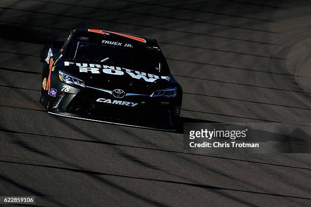 Martin Truex Jr., driver of the Furniture Row/Denver Mattress Toyota, practices for the NASCAR Sprint Cup Series Can-Am 500 at Phoenix International...