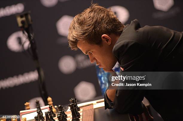 Reigning Chess Champion Magnus Carlsen reacts during the game against Chess grandmaster Sergey Karjakin at 2016 World Chess Championship at Fulton...