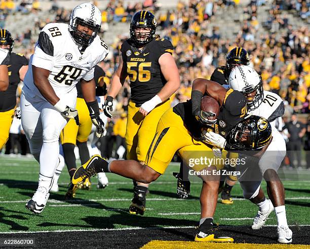 Damarea Crockett of the Missouri Tigers runs into the end zone for a touch down against Adam Butler and Oren Burks of the Vanderbilt Commodores in...