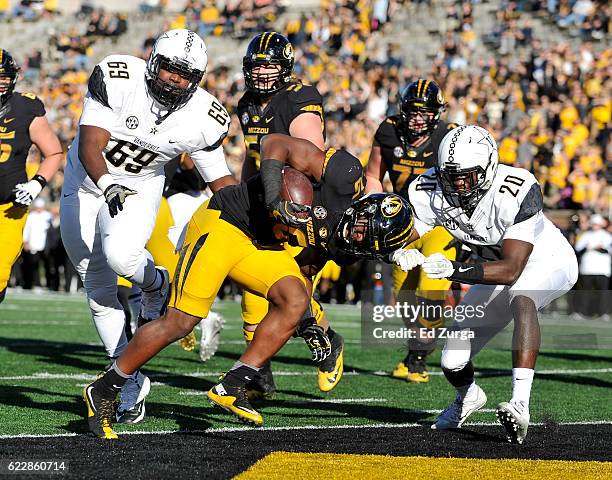 Damarea Crockett of the Missouri Tigers runs into the end zone for a touch down against Adam Butler and Oren Burks of the Vanderbilt Commodores in...