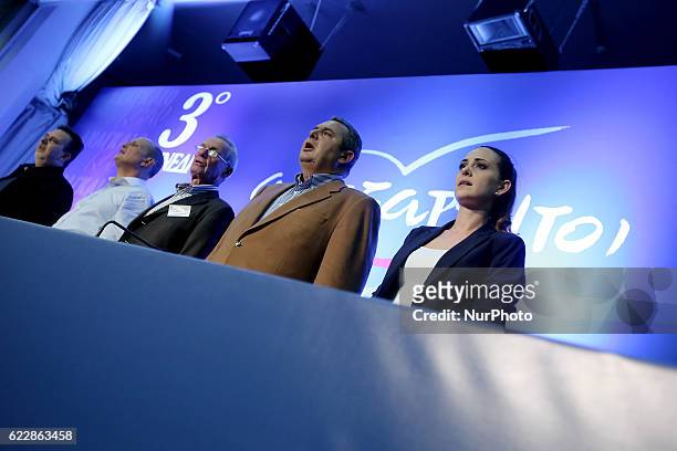President of the government's junior coalition member Independent Greeks and Greek Defense Minister Panos Kammenos and party members, chanting the...