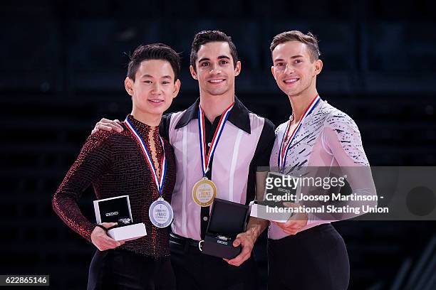 Denis Ten of Kazakhstan, Javier Fernandez of Spain, Adam Rippon of the United States pose during Men's Singles medal ceremony on day two of the...