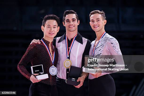 Denis Ten of Kazakhstan, Javier Fernandez of Spain, Adam Rippon of the United States pose during Men's Singles medal ceremony on day two of the...