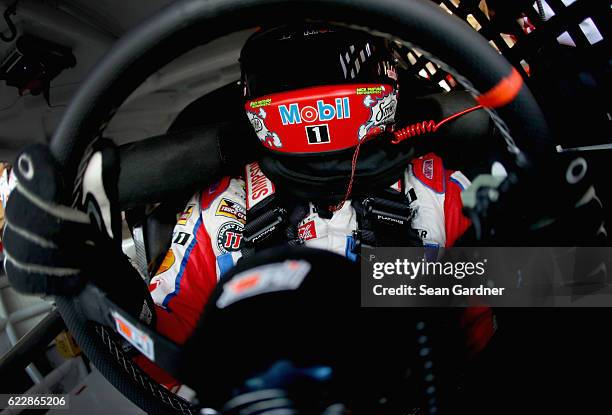 Tony Stewart, driver of the Mobil 1 Chevrolet, sits in his car during practice for the NASCAR Sprint Cup Series Can-Am 500 at Phoenix International...