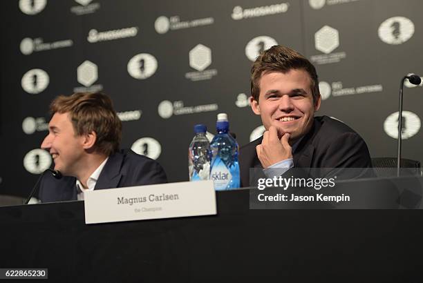 Reigning Chess Champion Magnus Carlsen and Chess grandmaster Sergey Karjakin speaks during the press conference after a draw at 2016 World Chess...