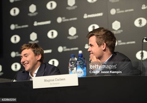 Reigning Chess Champion Magnus Carlsen and Chess grandmaster Sergey Karjakin speaks during the press conference after a draw at 2016 World Chess...