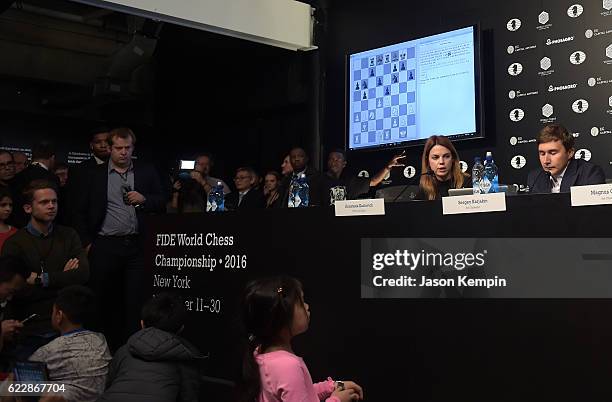 Press Officer Anastasia Karlovich and Chess grandmaster Sergey Karjakin speak at a press conference after a draw at 2016 World Chess Championship at...