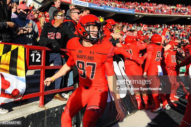 Maryland Terrapins place kicker Danny Sutton is greeted by fans after taking the field on November 12 at Capital One Field in College Park, MD.