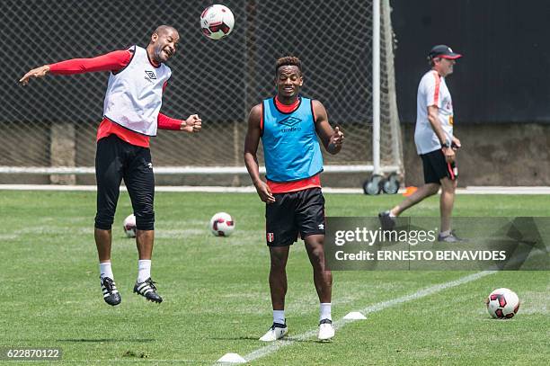 Peru's footballers Alberto Rodriguez and Andre Carillo take part in a training session in Lima on November 12 ahead of their WC 2018 qualifier match...