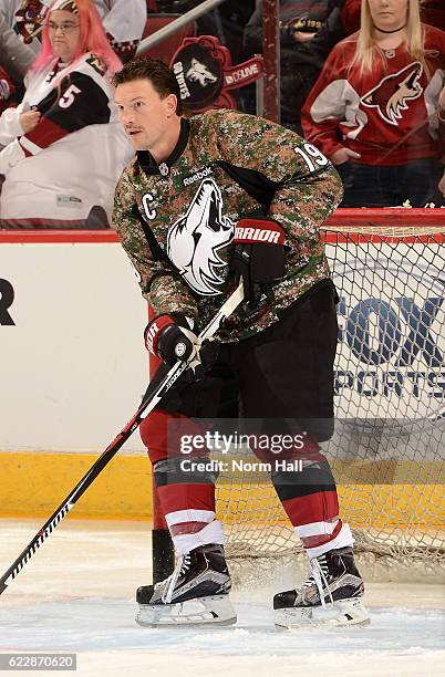 Shane Doan of the Arizona Coyotes warms up in a camouflage jersey prior to a game against the Boston Bruins at Gila River Arena on November 12, 2016...