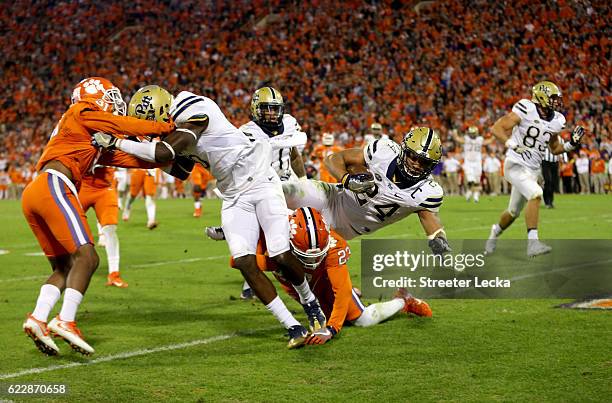 James Conner of the Pittsburgh Panthers runs for a touchdown against Van Smith of the Clemson Tigers during their game at Memorial Stadium on...