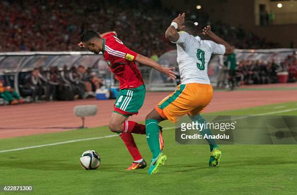 Sofiane Boufal of Morocco vies with Wilfried Kanon of Ivory Coast receives a treatment during the 2018 World Cup qualifying Group C football match...