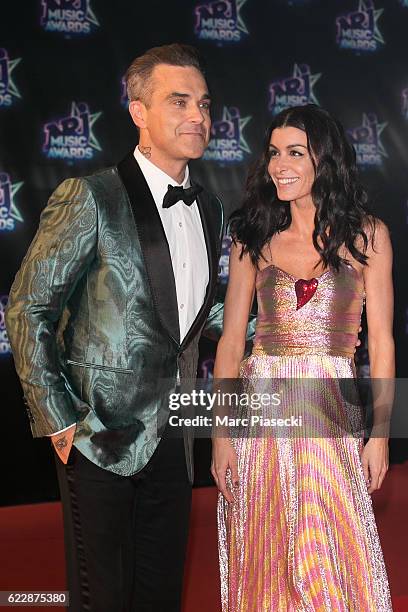 Singers Robbie Williams and Jenifer Bartoli attend the 18th NRJ Music Awards at Palais des Festivals on November 12, 2016 in Cannes, France.