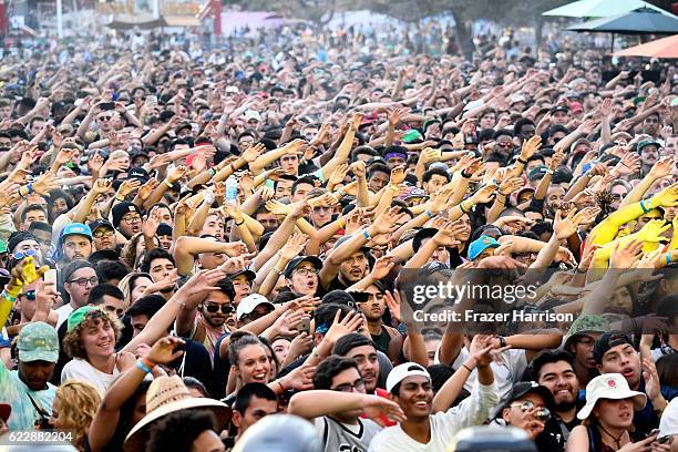 Festival goers watch Domo Genesis perform on Flog Stage during day one of Tyler, the Creator's 5th Annual Camp Flog Gnaw Carnival at Exposition Park...