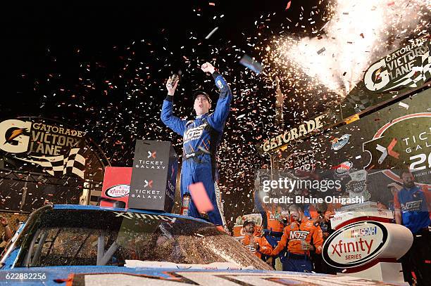 Kyle Busch, driver of the NOS Energy Drink Toyota, celebrates in Victory Lane after winning the NASCAR XFINITY Series Ticket Galaxy 200 at Phoenix...