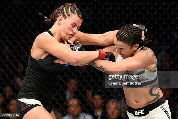 Miesha Tate of the United States fights against Raquel Pennington of the United States in their women's bantamweight bout during the UFC 205 event at...