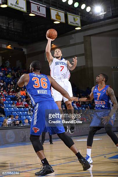 Brandon Triche of the Delaware 87ers shoots the ball against Keith Wright of the Westchester Knicks during the game at the Bob Carpenter Center in...