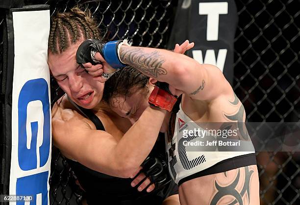 Miesha Tate of the United States fights against Raquel Pennington of the United States in their women's bantamweight bout during the UFC 205 event at...