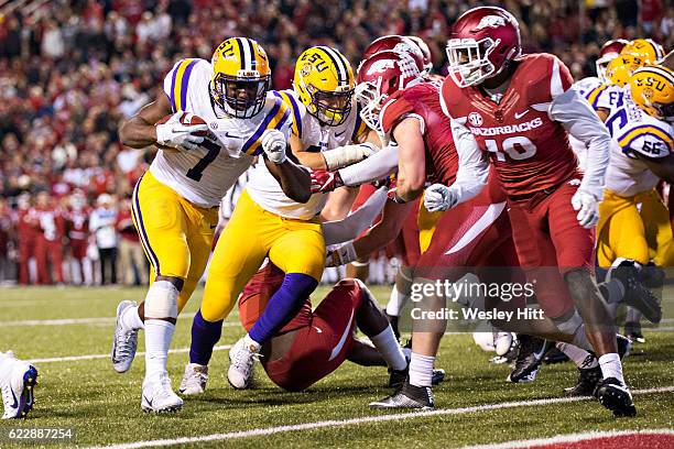 Leonard Fournette of the LSU Tigers runs the ball in for a touchdown against the Arkansas Razorbacks at Razorback Stadium on November 12, 2016 in...