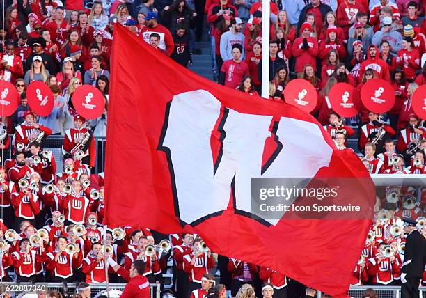 Wisconsin flag in the end zone after Wisconsin scores with the band in the background. Wisconsin beat Illinois by a final score of 48-3 at Camp...