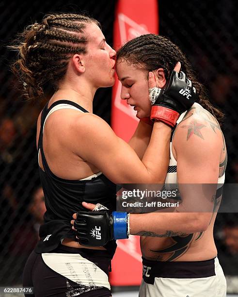 Miesha Tate of the United States embraces Raquel Pennington of the United States after her unanimous decision defeat in their women's bantamweight...