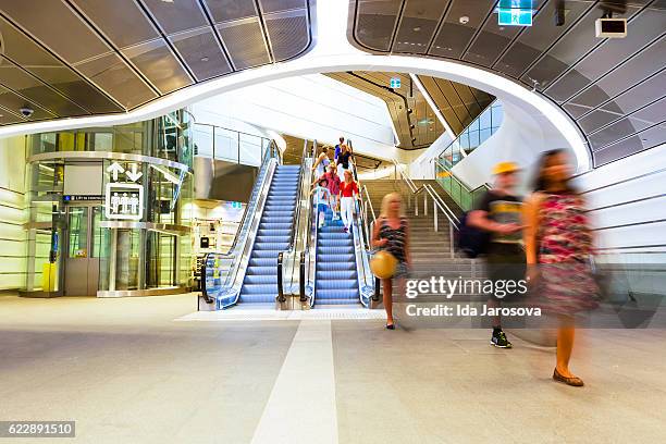 modern underground subway with passengers and travellers sydney australia - barangaroo stock pictures, royalty-free photos & images