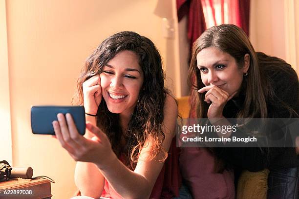 Beautiful Mother and Daughter on Mobile Video Call with Phone