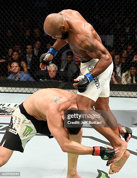 Chris Weidman of the United States fights against Yoel Romero of Cuba in their middleweight bout during the UFC 205 event at Madison Square Garden on...