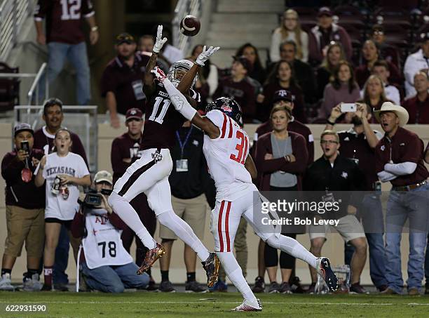 Josh Reynolds of the Texas A&M Aggies catches a 13 yard pass for a touchdown as Jaylon Jones of the Mississippi Rebels is unable to knock the ball...