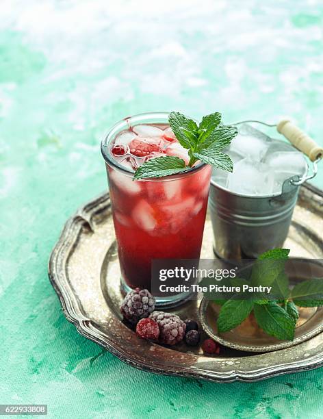 mixed berries spritzer - spritzer stock pictures, royalty-free photos & images