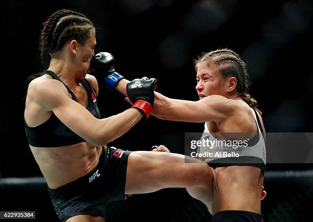 Karolina Kowalkiewicz of Poland fights against Joanna Jedrzejczyk of Poland in their women's strawweight championship bout during the UFC 205 event...