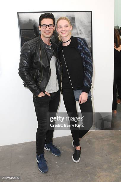 Actor Steven Strait and Dario Zhemkova attend 'Hindsight Is 30/40 - A Group Photographer Exhibition' at The Salon at Automatic Sweat on November 12,...