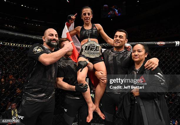 Joanna Jedrzejczyk of Poland celebrates her victory over Karolina Kowalkiewicz of Poland in their women's strawweight championship bout during the...