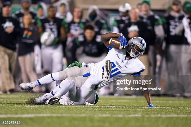 Middle Tennessee Blue Raiders WR Ty Lee is tackled by Marshall Thundering Herd S Corey Neely after making a catch during the second quarter of the...