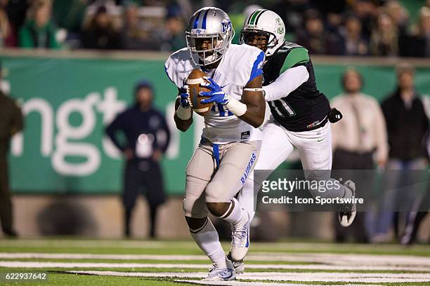 Middle Tennessee Blue Raiders WR Dennis Andrews makes a 7-yard touchdown catch as Marshall Thundering Herd DB Rodney Allen defends during the first...