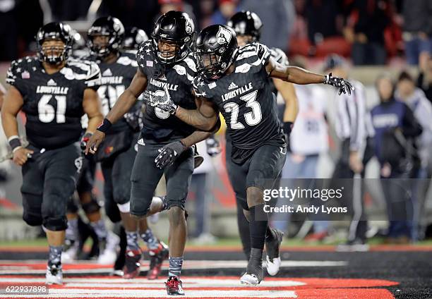 Lamar Jackson and Brandon Radcliff of the Louisville Cardinals celebrate after Radcliff ran for a touchdown during the game against the Wake Forest...