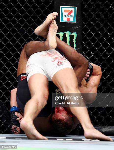 Tyron Woodley of the United States fights against Stephen Thompson of the United States in their welterweight championship bout during the UFC 205...