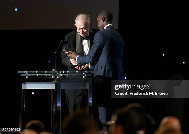 Actor Don Cheadle presents an award to Honoree Frederick Wiseman during the Academy of Motion Picture Arts and Sciences' 8th annual Governors Awards...