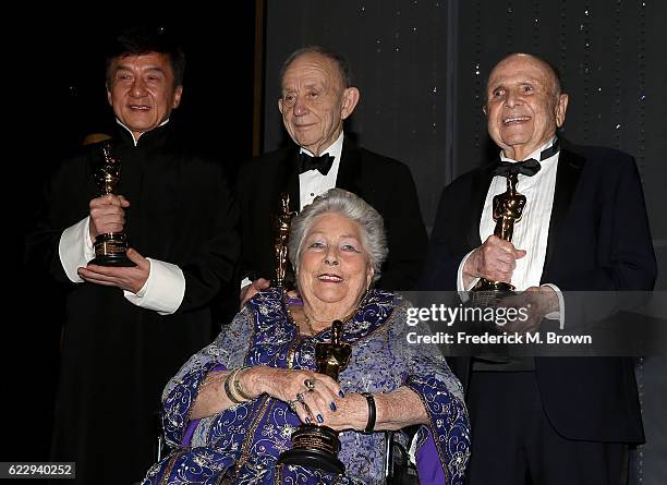 Honorees Jackie Chan, Frederick Wiseman, Anne V. Coates and Lynn Stalmaster pose with their awards during the Academy of Motion Picture Arts and...
