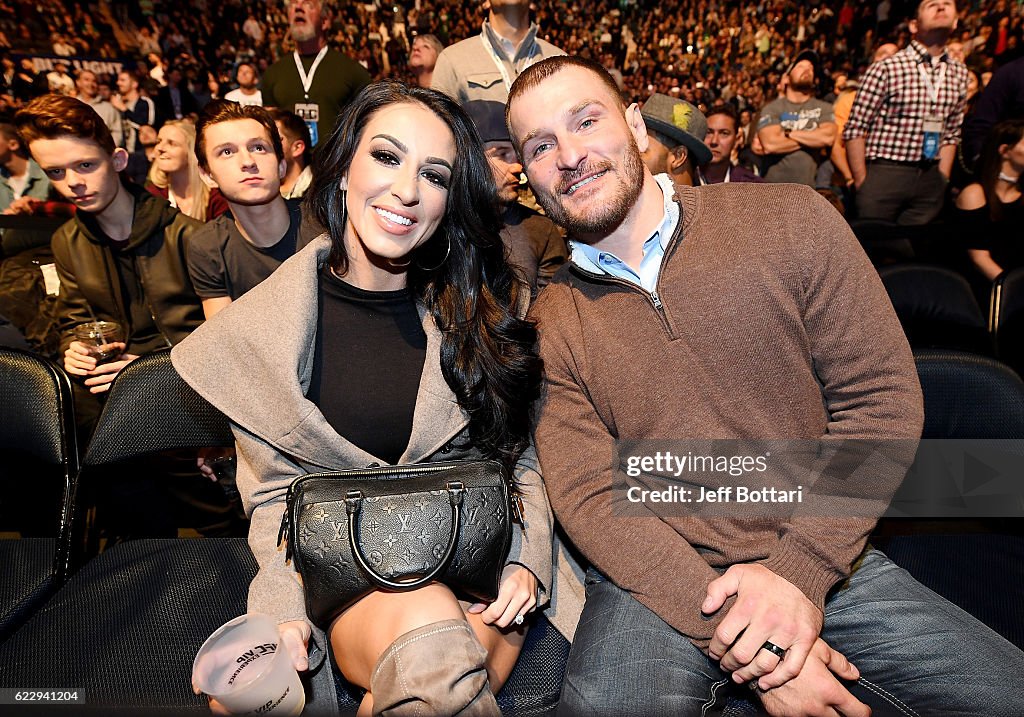 Ryan Marie Carney and UFC fighter Stipe Miocic are seen during the