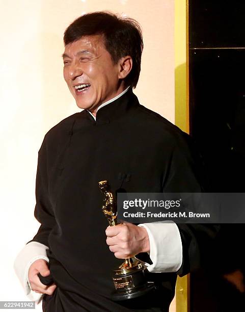 Honoree Jackie Chan accepts an award onstage during the Academy of Motion Picture Arts and Sciences' 8th annual Governors Awards at The Ray Dolby...