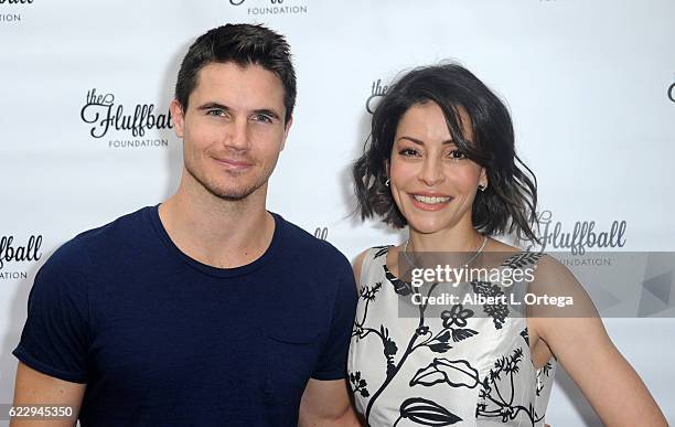Actor Robbie Amell and actress Emmanuelle Vaugier at the 2016 Fluffball Event held at The Little Door on November 12, 2016 in Los Angeles, California.