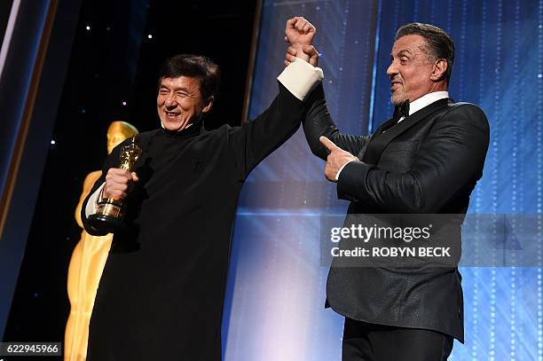 Honoree Jackie Chan poses with actor Sylvester Stallone after Chan accepted his Honorary Oscar Award during the 8th Annual Governors Awards hosted by...