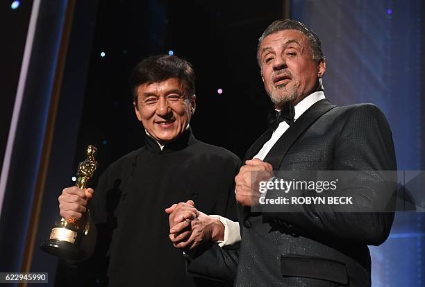 Honoree Jackie Chan poses with actor Sylvester Stallone after Chan accepted his Honorary Oscar Award during the 8th Annual Governors Awards hosted by...